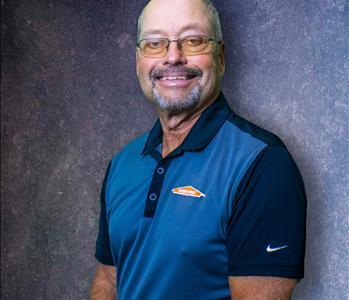 male, glasses, smiling, blue background